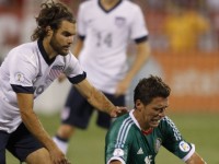 Hector Moreno (R) of Mexico and Graham Zusi of USA fight for the ball